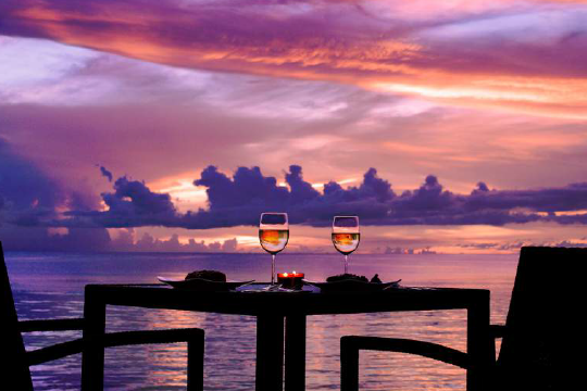 a sunset over a body of water