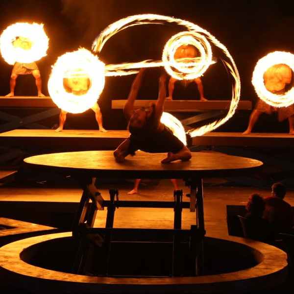 a person sitting at a table in a dark room