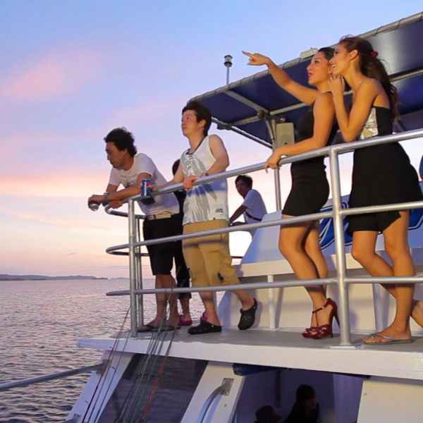 a group of people on a boat in the water