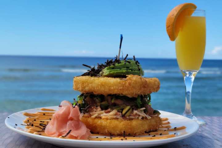 a plate of food and a cup of water