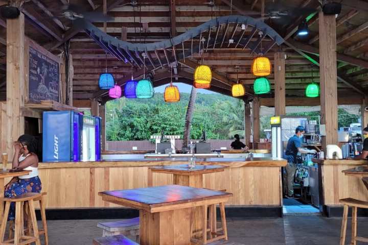 a group of people sitting around a wooden table